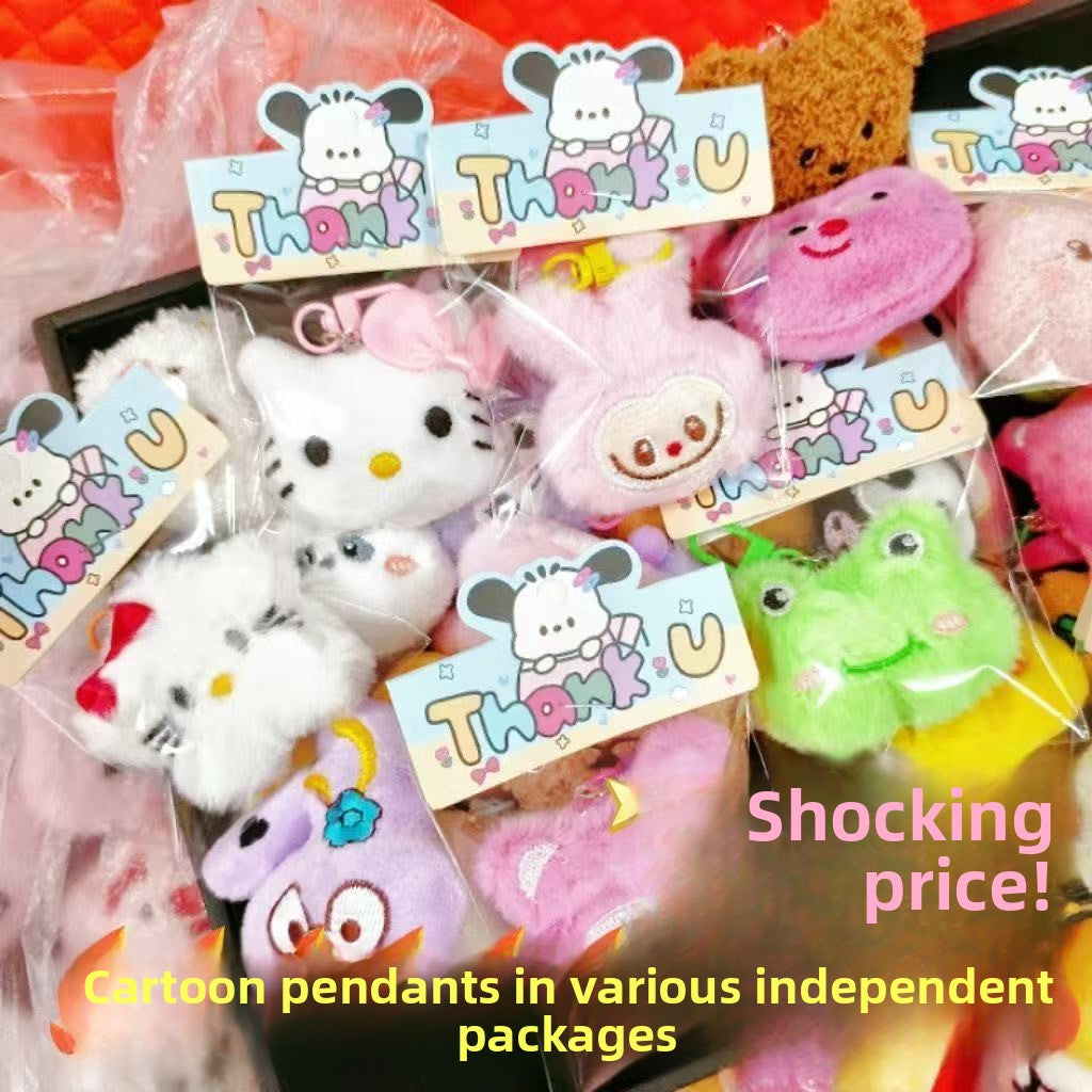 Colorful plush doll keychains featuring cartoon characters in individual packaging.
