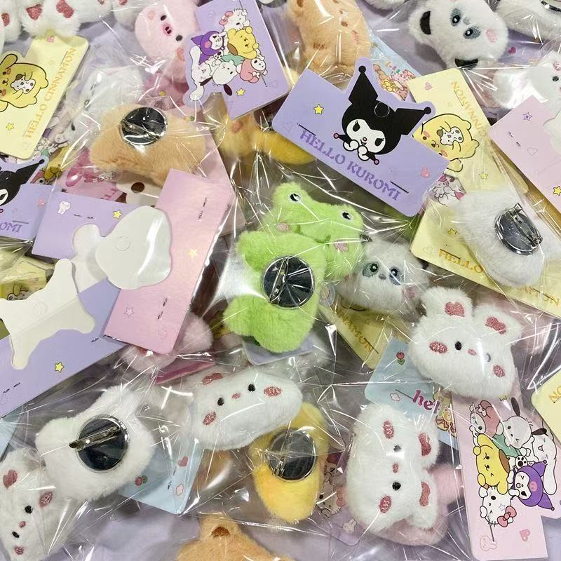 Colorful plush doll keychains featuring adorable animal designs and cartoon styling in various colors.